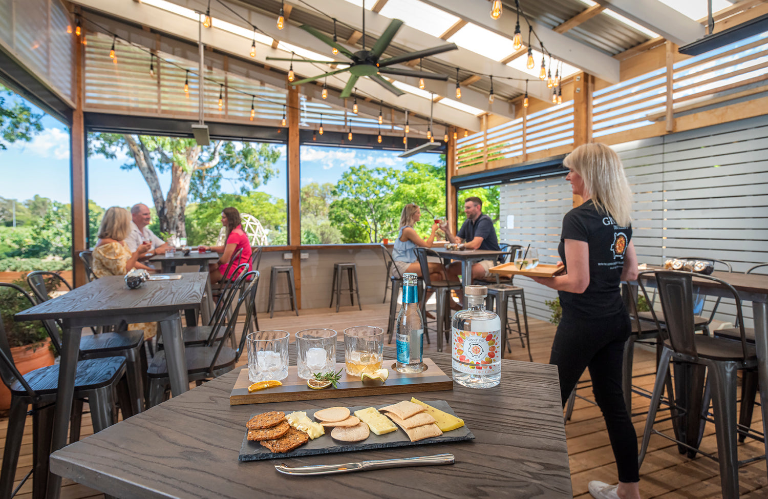 Ginny Pig Distillery Tasting room, customers sitting drinking gin