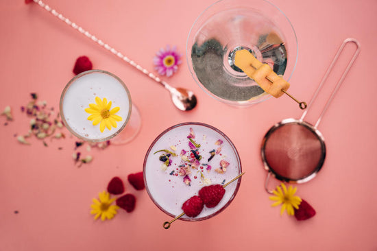 Pretty gin cocktails arranged with garnishes