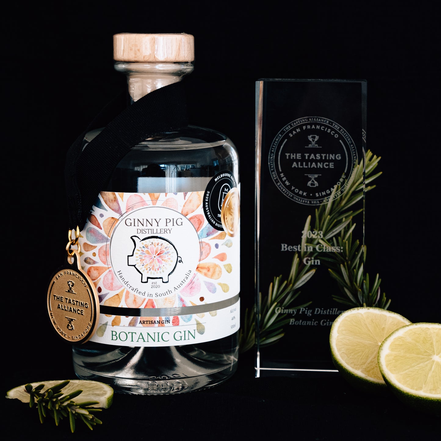 Ginny Pig Botanic Gin wins The Tasting Alliance Best in Class Gin in 2023. Gin with gold medal next to a glass trophy.